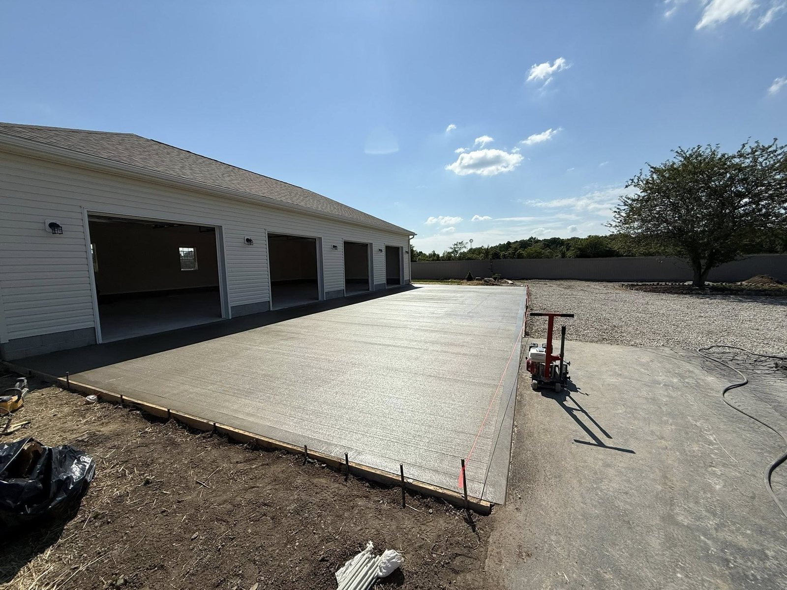 Residential home with a new concrete driveway and front walkway